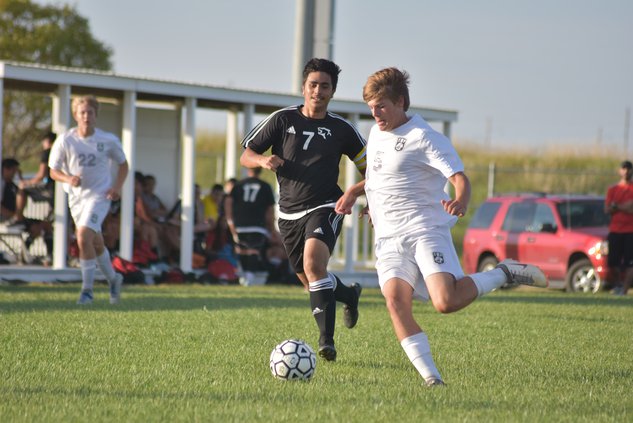 DSC_2993 Dani Franco (7)  challenges for ball possession against TMP soccer player Zach Braun (5)..jpg