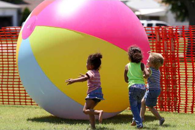 A giantic beach ball was enjoyed by all ages.