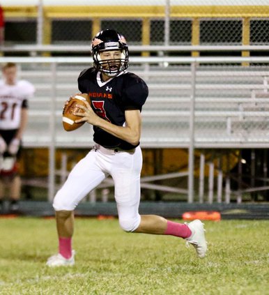 Dillan Smith rolls right and hits Brock Skelton in the end zone for an Indian touchdown..jpg