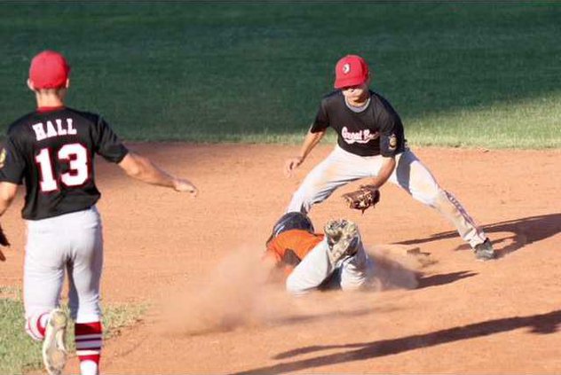 Austin Gladow gets caught in a run down between first and second but beats the throw and is safe at second base.