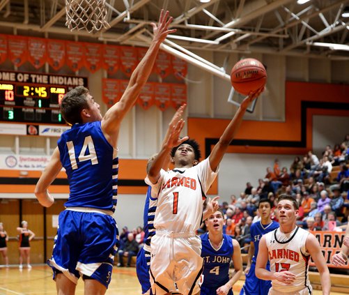 Jaylen Thomas puts up a left handed layup and scores.jpg