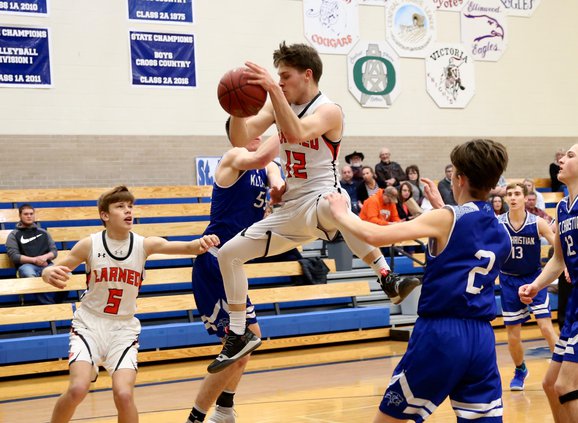 Chance Sanger grabs an offensive rebound..jpg