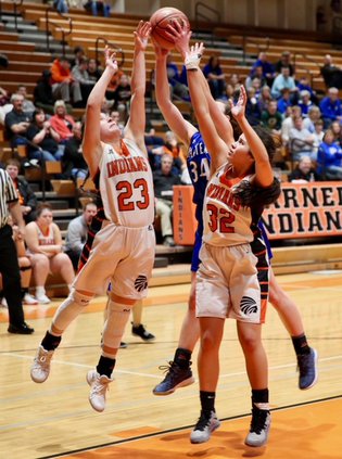 Baylea Perez and Julie Tapia battle for a rebound..jpeg