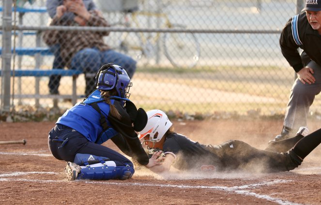 Larned's Ivory Muldrow slides past catcher Ashley Fierro.jpeg
