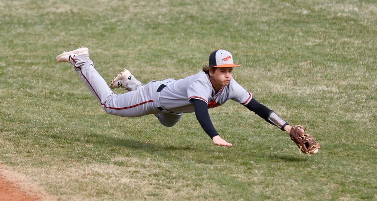 Braydon Lemuz snags a hard hit grounder between first and second in game one..jpeg