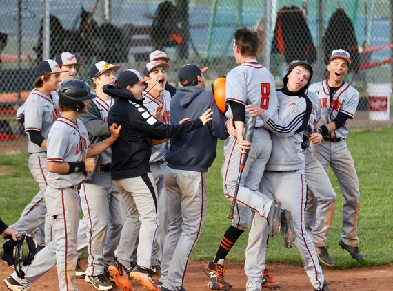 The Indians celebrate after Jack Stelter's winning RBI in game one..jpeg