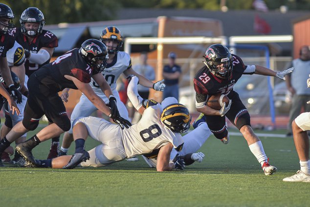 Great Bend Panther Gage Fritz runs past Grizzliez defense_2.jpg