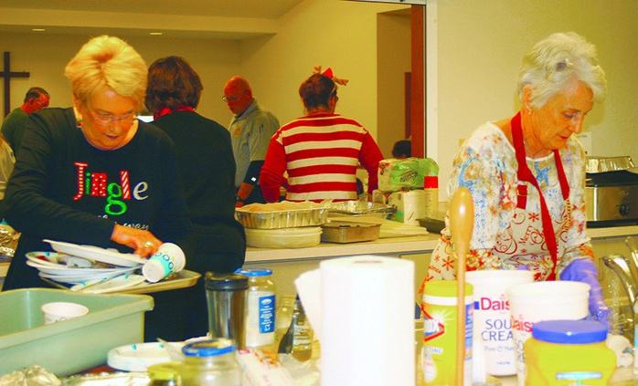 Volunteers wash dishes.jpg