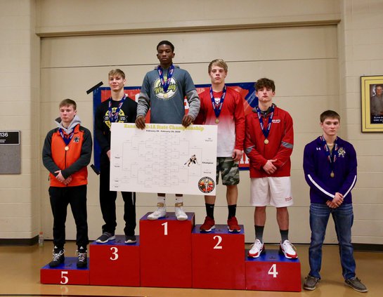 Larned's 2020 3A 145 - State Champion Samajay Alboyd on the podium.