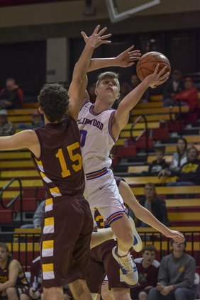 Ellinwood's Britton Dutton (0) scores against Victoria Tuesday.jpg