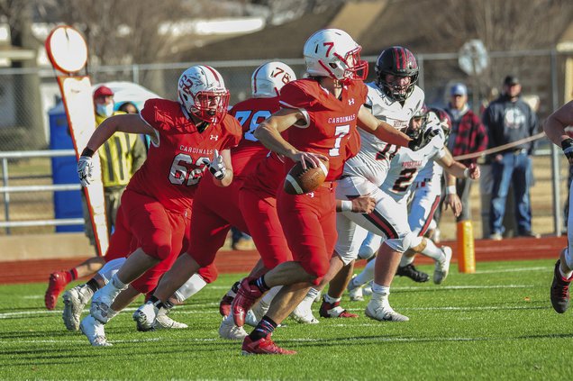Mason Haxton prepares to throw a complete pass.jpg
