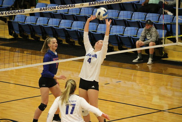 Alyssa Herter, Great Bend freshman, sets the ball for the Cougars