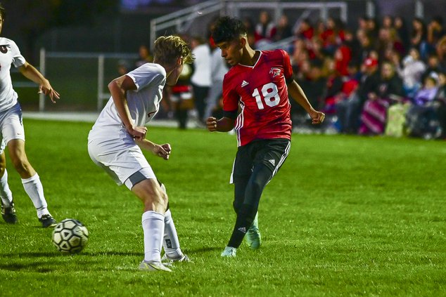 Great Bend's Gustavo Alvarado connects with a drop back pass.jpg