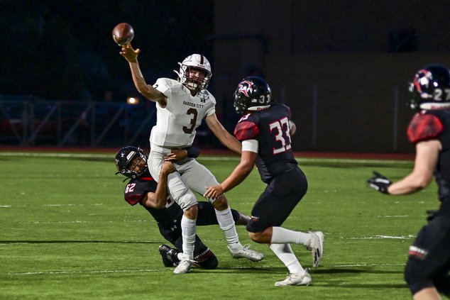 Great Bend's Dee'Onn Jones gets to quarterback Celeb Wiese.jpg