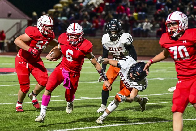 Hoisington's Wyatt Wikum rushes the football against Ellis.jpg