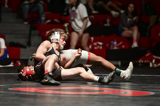 Great Bend Panther wrestler Kaden Spragis prepares to pin down Frio Vontress.jpg