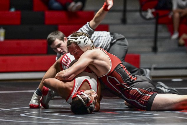 Great Bend wrestler Wyatt Weber grapples Liberal's Also Hernandez.jpg