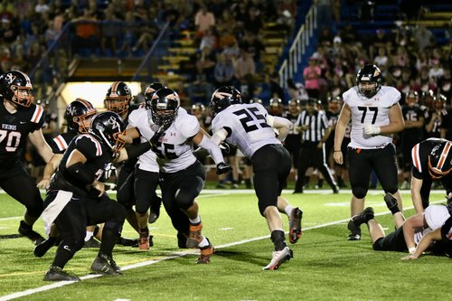 Luke Fischer picks up tough yardage up the middle.jpg
