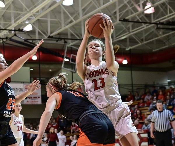 Hoisington's Kelsi Maier rebounds for the Cardinals.jpg