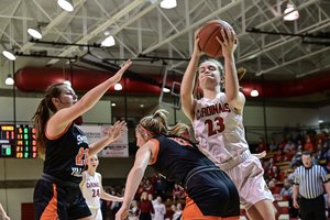 Hoisington's Kelsi Maier rebounds for the Cardinals.jpg