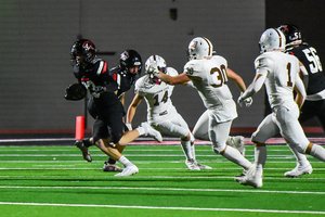 Great Bend WR Cooper Ohnmacht picks up the kick off and scores a touchdown .jpg