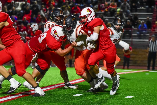 Cardinal Jason Robinson carries for a gain.jpg