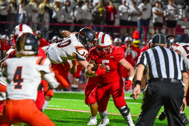 Cardinal Teron Kraft runs up the middle.jpg