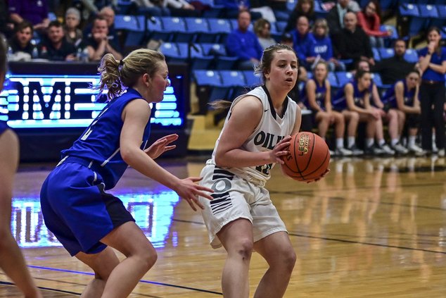 Addyson Ogle holds the basketball.jpg