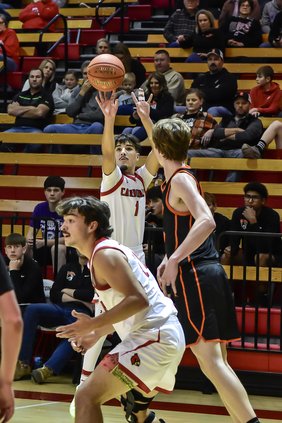 Hoisington Cardinal Rhen Galla shoots a three point basket against Beloit.jpg