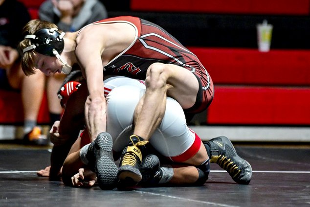Great Bend wrestler Cooper Liles grapples Liberal's Irvin Mendez.jpg