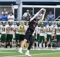 Tristan Regan grabs a pass from Mason Miller
