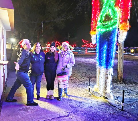 Landmark volunteers trail of lights
