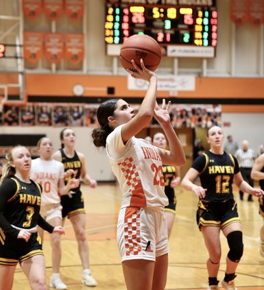 lauren sleder drives the lane