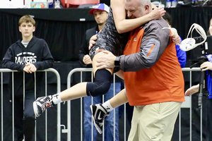 Cara Herbert celebrates with Coach Sleder