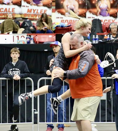 Cara Herbert celebrates with Coach Sleder