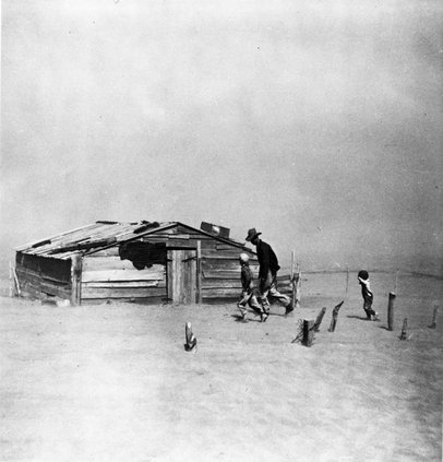 Farmer and sons walking in the face of a dust storm, Cimarron County, Oklahoma